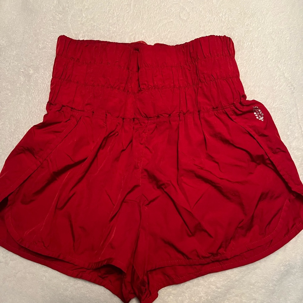 Free People movement Red shiny shorts.